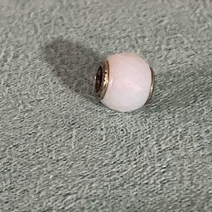 Abstract silver charm with faceted opalescent white crystal